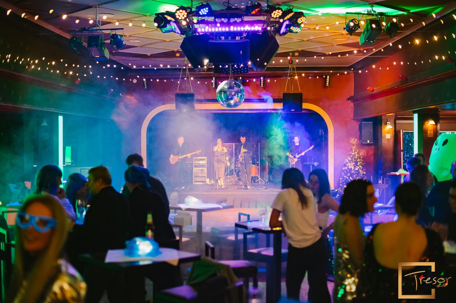 People watching a concert. Photo with a purple hue